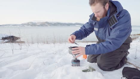 Camper-Making-Herbal-Pine-Needle-Tea-Using-Portable-Stove