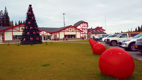 4K-Drone-Video-of-Christmas-Tree-at-Santa-Claus-House-in-North-Pole,-Alaksa-during-Summer-Day