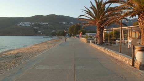Beautiful-promenade-at-sunset-by-the-sea-in-the-bay-of-the-small-typical-village-of-Egliali-on-the-island-of-Amorgos-in-Greece