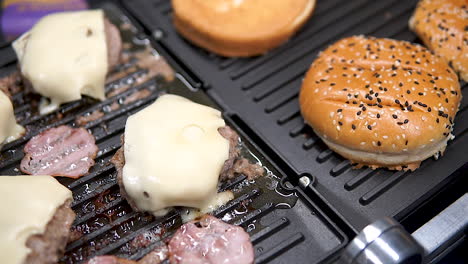 Grilling-Patty-With-Cheese-And-Buns-In-The-Griller---Making-Burgers