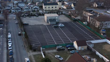 An-aerial-view-of-a-car-dealer-storage-lot-at-sunset