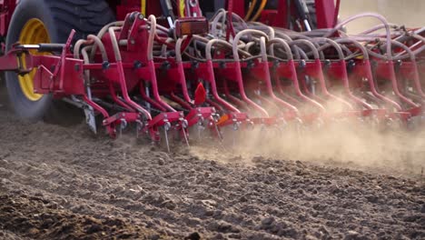 Close-up-of-tractor-instrument-working-in-a-field-during-the-sowing-season