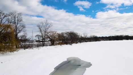 Tracking-across-the-shoreline-of-Mona-Lake-in-winter
