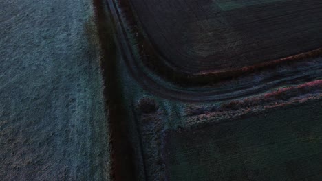 Farmers-track-on-a-frosty-cold-winters-morning-in-the-English-countryside-in-the-UK
