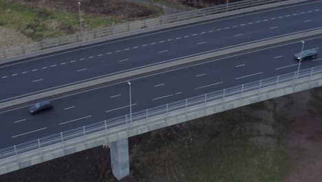 Mersey-gateway-toll-bridge-highway-traffic-driving-across-river-estuary-aerial-Birdseye-view-tilt-up-right