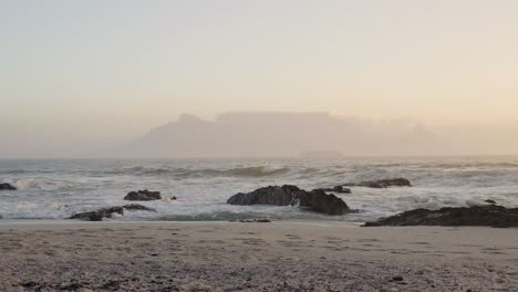 Waves-on-the-Blouberg-Beach-with-the-view-of-Table-Mountain-on-the-horizon