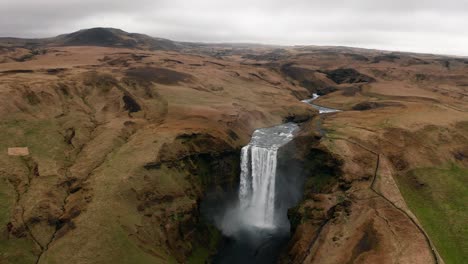 Drone-video-approaching-Iceland's-Skogafoss-Waterfall-in-Winter