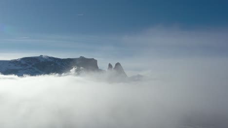 Winter-Alpe-di-Siusi-above-the-clouds,-Dolomites