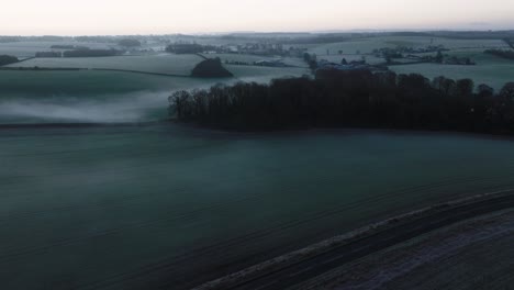 Misty-Landscape-Warwickshire,-Chesterton,-Aerial-View,-Frosty-Pre-dawn
