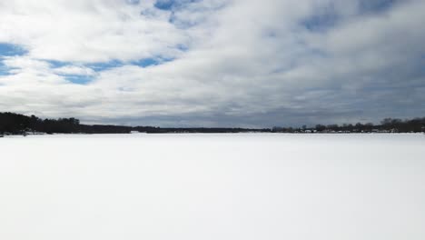 Fast-and-long,-pushing-forward-in-harsh-winds-over-iced-lake