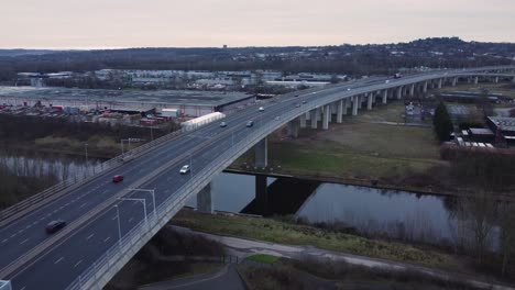 Mersey-gateway-toll-bridge-highway-traffic-driving-across-river-estuary-aerial-static-view