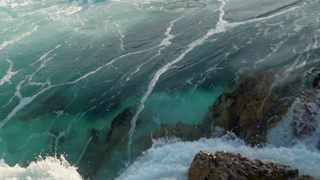 Ocean-water-moving-through-the-rocks-in-slow-motion