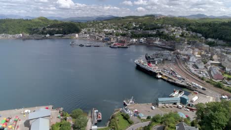 Aerial-push-in-shot-above-the-town-of-Oban-and-the-seaside-port