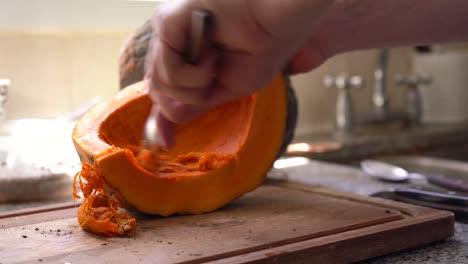 Hands-Scraping-Squash-Pulp-And-Seeds-Using-Spoon