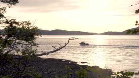 Speedboat-Cruising-In-The-Glistening-Water-Of-Sea-At-Sunrise