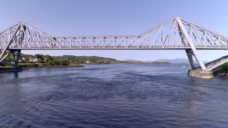Right-to-left-aerial-shot-tracking-the-Connel-Bridge-on-a-clear-day-looking-towards-Mull