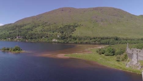 Left-to-right-aerial-track-shot-above-Loch-Awe-passing-Kilchurn-Castle
