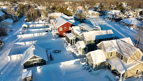 Back-yard-of-homes-covered-in-winter-snow