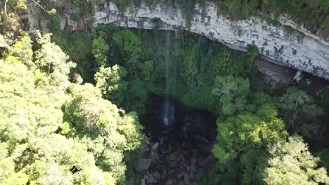 Drone-footage-of-a-beautiful-landscape-near-a-canyon-and-a-waterfall
