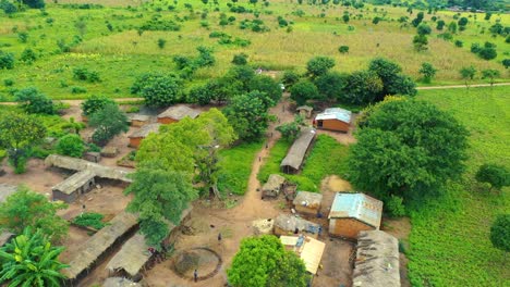 Drone-flying-low-over-a-village-in-Malawi,-Africa