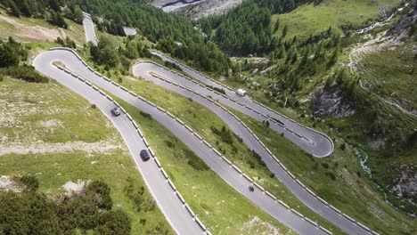 Aerial-Top-Down-Drone-View-of-the-Stelvio-Mountain-Pass-Road-in-Italy---Cars-and-Motor-Driving-the-Hairpins-Curves