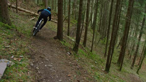 A-mountain-biker-rides-fast-down-a-secret-trail