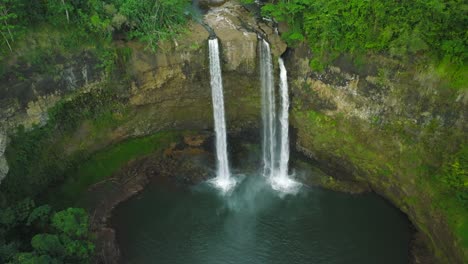 Wide-Aerial-Dolly-Backwards-to-Reveal-the-pool-formation-at-Opaekaa-Falls,-Hawaii