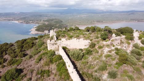 Old-Castle-and-Ruin-at-Voidokilia-Beach,-Peloponnesos,-Greece---Aerial-Drone-View