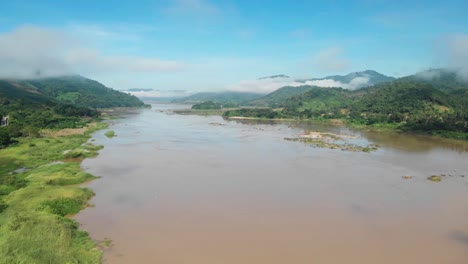 The-Mekong-River-Ecology-and-Environment-affected-through-Chinese-funded-Hydropower-Dam-Projects,-Beautiful-Mekong-River-with-Misty-Mountains