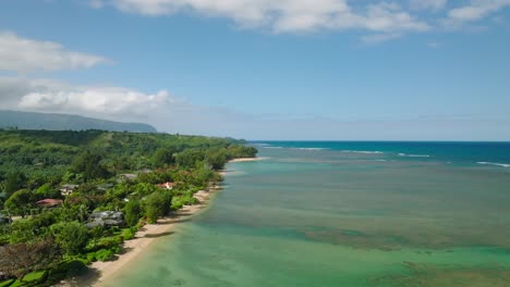 Wide-Aerial-Dolly-moving-forward-alongside-Anini-Beach,-Kauai,-Hawaii