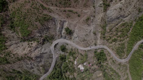 Video-with-drone-of-previous-aerial-shot,-of-a-crane-ascending-on-the-Sh25-in-albania-with-the-Drin-River-in-the-plane