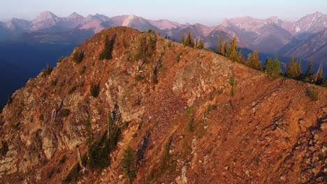 Golden-hour-orbiting-around-the-mountain-in-South-Rockies,-BC,-aerial-shot,-001