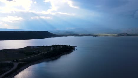 Sun-Shining-through-Clouds-over-Lake-Granby-in-Colorado-|-Aerial-Panning-View-|-Summer-2021