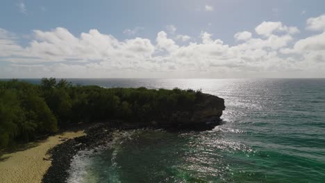 Aerial-Dolly-over-the-cliff-at-Shipwreck-beach-traveling-towards-the-Ocean