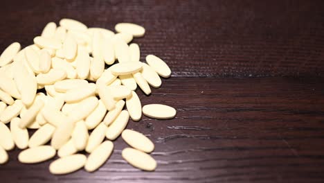 a-pile-of-yellow-pills,-slow-slider