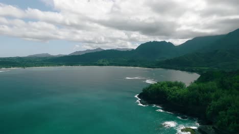 Wide-Aerial-Tracking-shot-during-daytime-of-Hanalei-Bay,-Hawaii