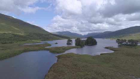 Rising-aerial-shot-above-loch-islands-on-Loch-Ossian-in-Rannoch-Moor