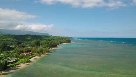Extreme-wide-Slow-aerial-orbit-above-Anini-Beach,-Kauai,-Hawaii