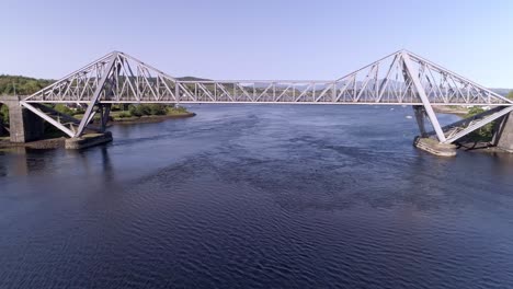 Aerial-pullback-shot-revealing-the-Connel-Bridge-on-a-sunny-day
