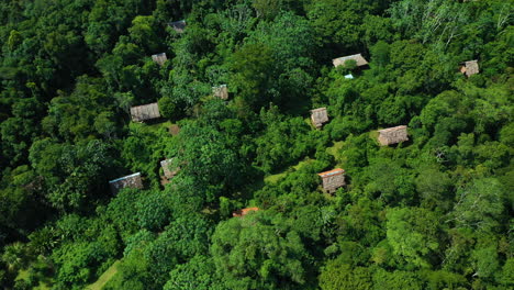 Cinematic-wide-drone-shot-of-jungle-lodges-in-the-Amazon-Rainforest-in-Iquitos-Peru-near-the-Amazon-River