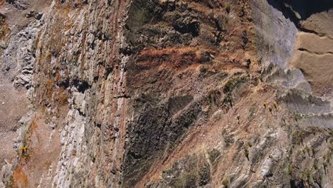 Aerial-top-down-shot-following-the-very-steep-rocky-ridgeline