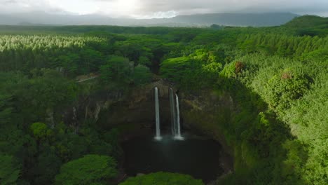 Extreme-Wide-Aerial-Dolly-in-of-Opaekaa-Falls-in-Daylight,-Hawaii