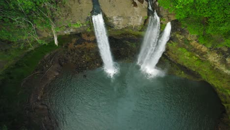 Dramatic-Aerial-Push-in-from-Wide-Top-Shot-to-Close-Up-at-Opaekaa-Falls,-Hawaii