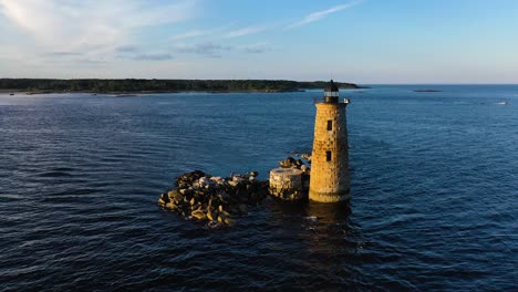 Portsmouth,-NH-Lighthouse-Orbit-over-sea-during-summer-sunset