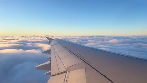 International-flight-images-from-the-window-of-the-plane-flying-over-the-clouds-to-that-of-the-aircraf-going-through-the-clouds