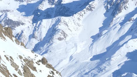 Details-on-rocky-and-snowy-mountain-walls-in-the-Alps-of-Tyrol---pan-shot