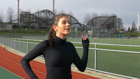 Beautiful-Sporty-Woman-Finishes-Running-After-Laps-on-the-Track-SLOMO