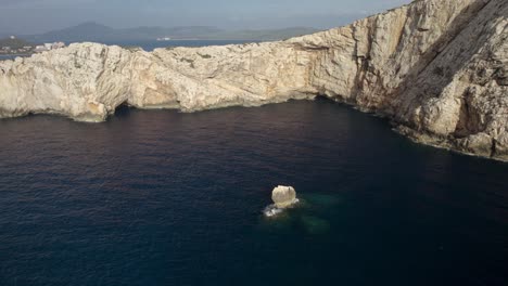 Aerial-orbit-over-the-cliffs-of-the-Capo-Coccia,-a-famous-tourist-destination-in-Sardinia,-Italy