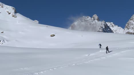 Hikers-snowshoe-skiing-in-powder-snow-of-the-Alps-of-Tyrol,-winter-in-Austria