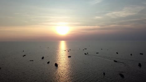 Aerial-sunset-view-of-fishermen-boats-in-Cambodia